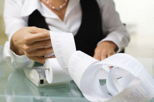 A woman doing paperwork in an office